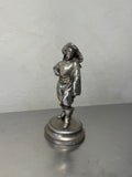 Antique metal musketeer figurine