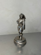 Antique metal musketeer figurine