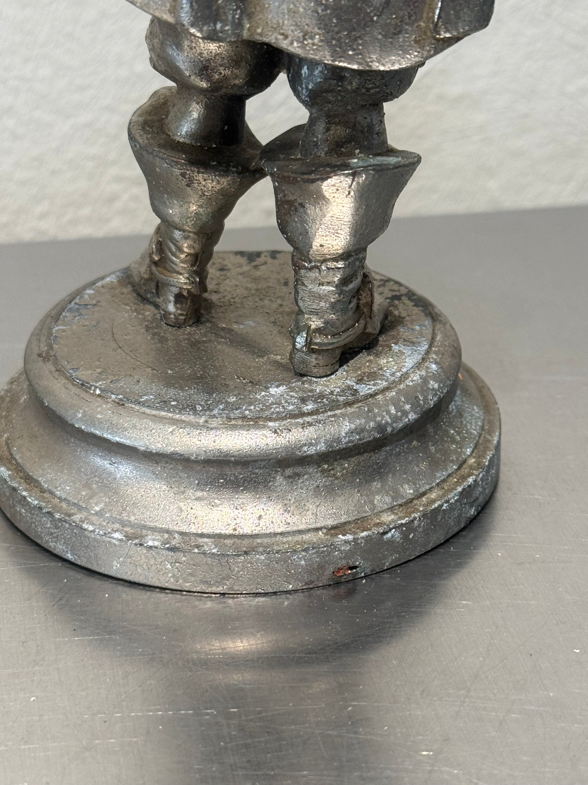 Vintage metal musketeer figure side view
