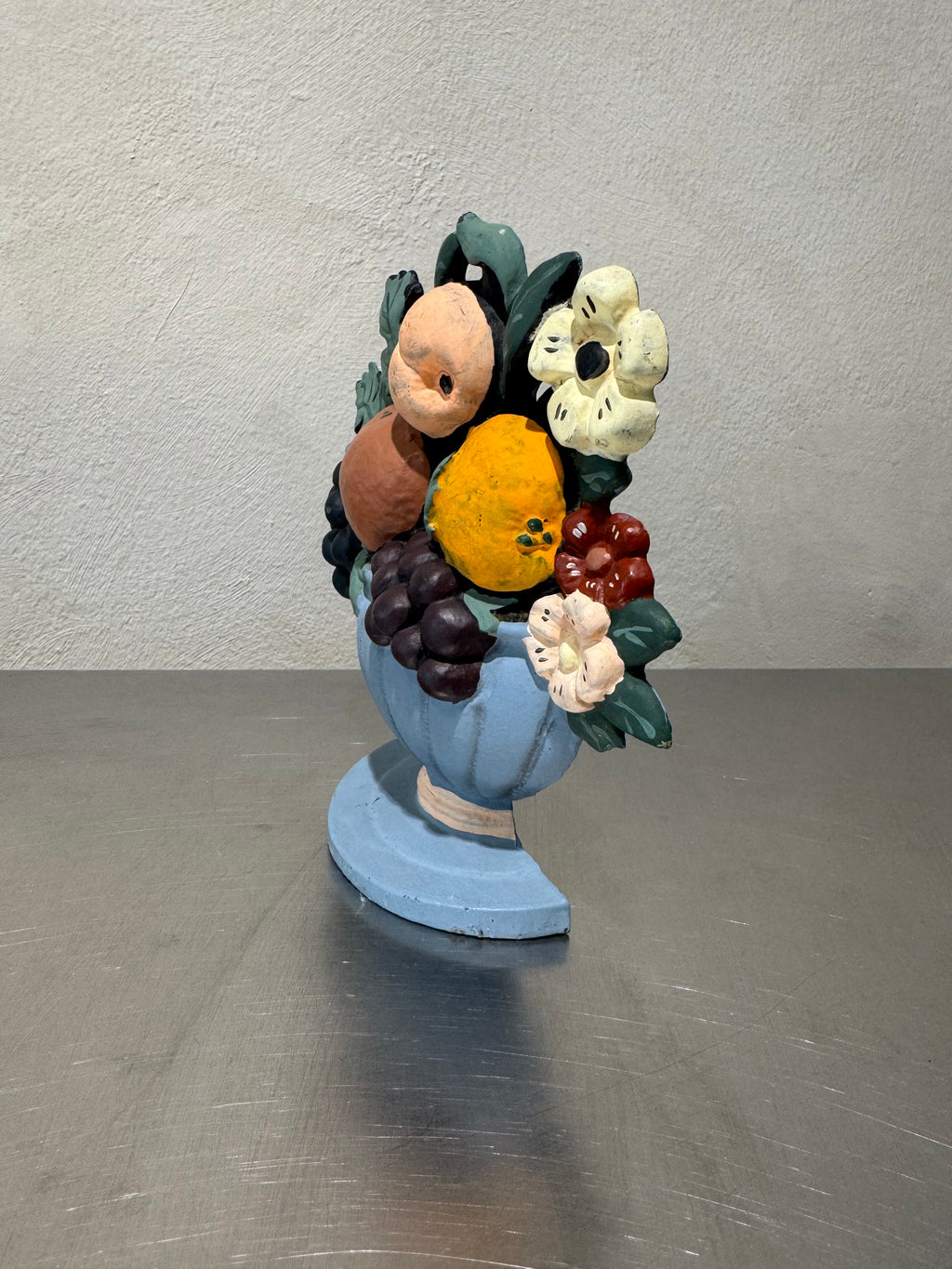 Canadian cast iron doorstop with fruit and flower motifs