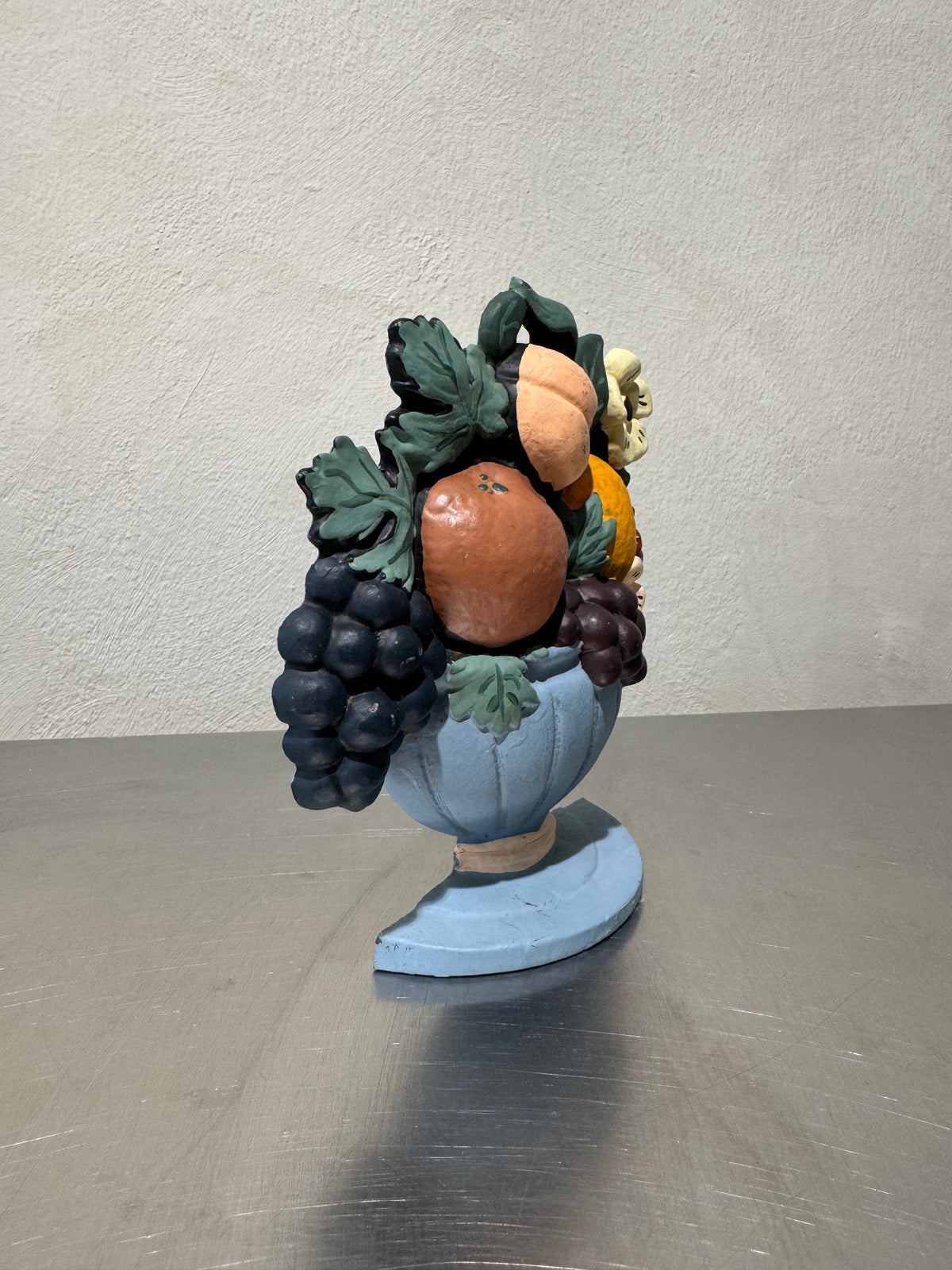 Hand-painted cast iron doorstop detail