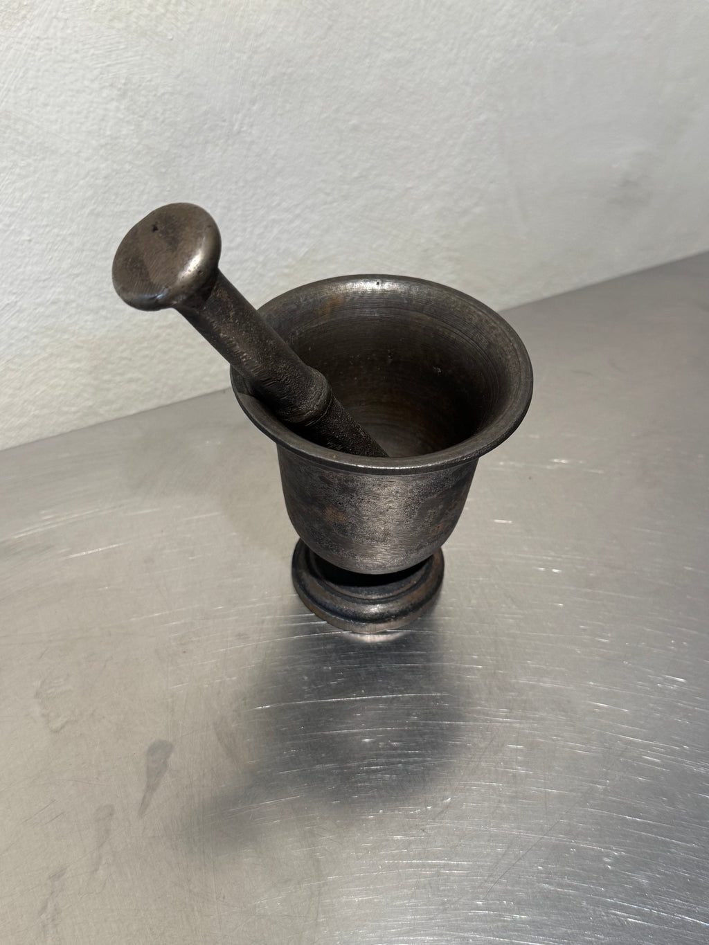 Late 1800s cast iron mortar side view