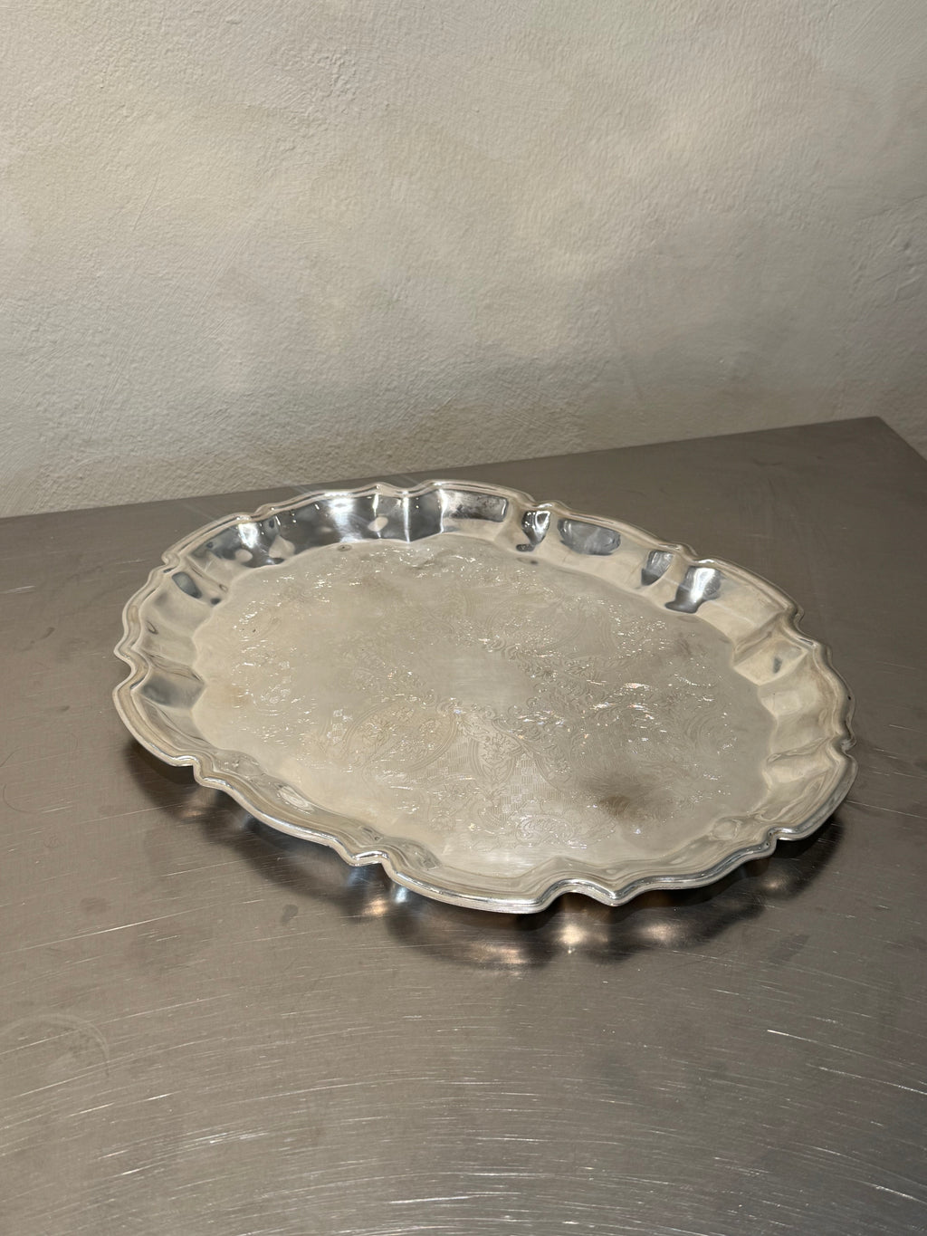 Mid-century silver-plated serving tray with ornate border