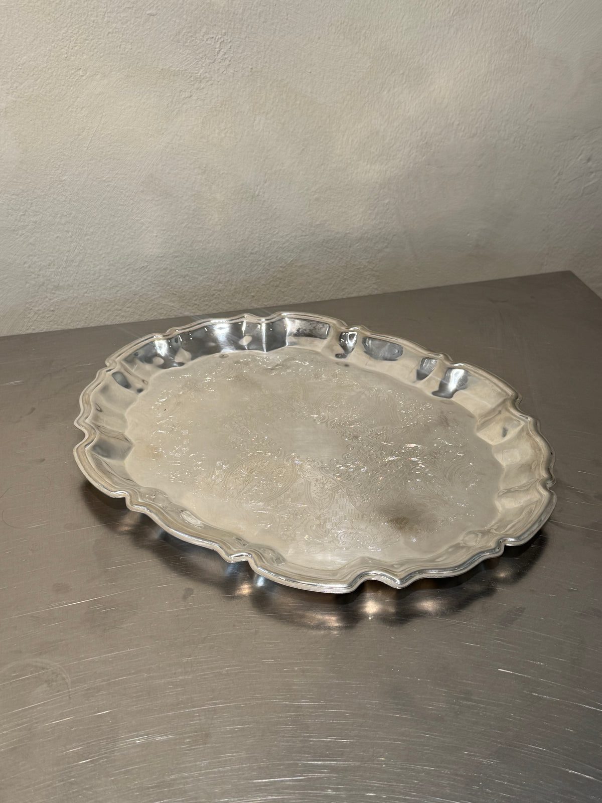 Mid-century silver-plated serving tray with ornate border