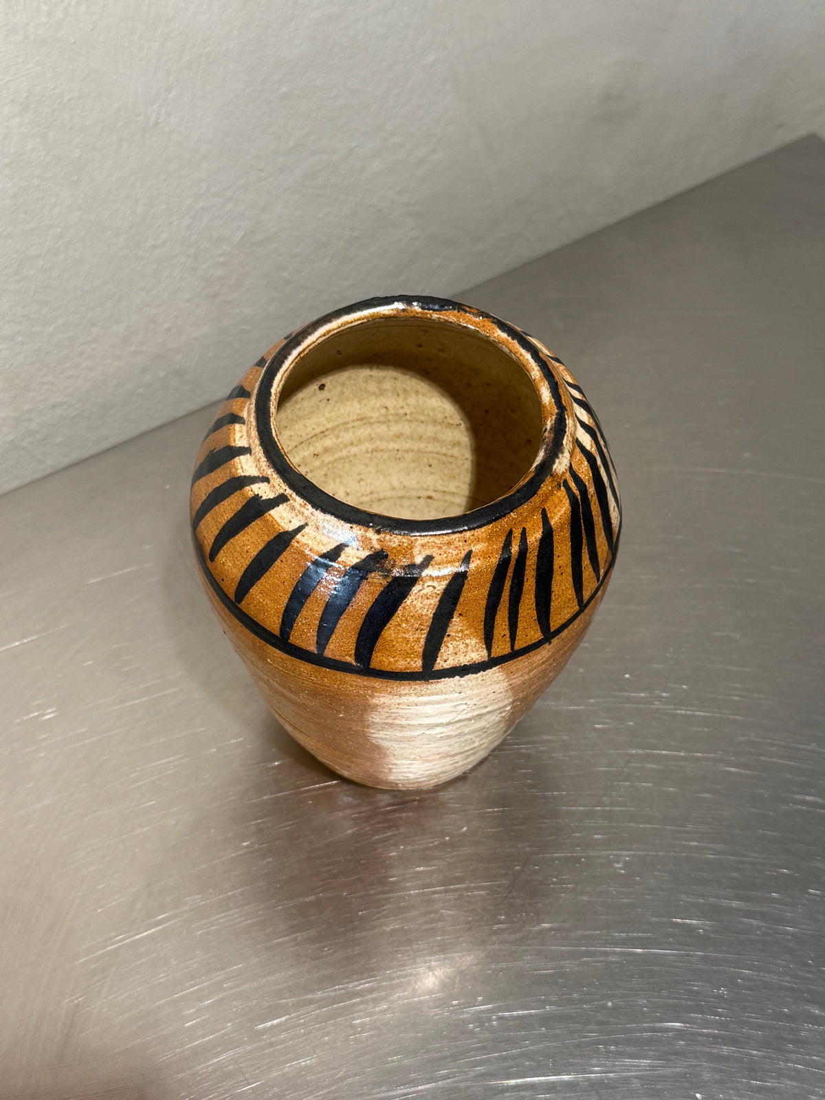 Unsigned hand-painted stoneware vase detail