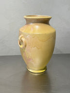 Yellow drip-glaze ceramic vase detail