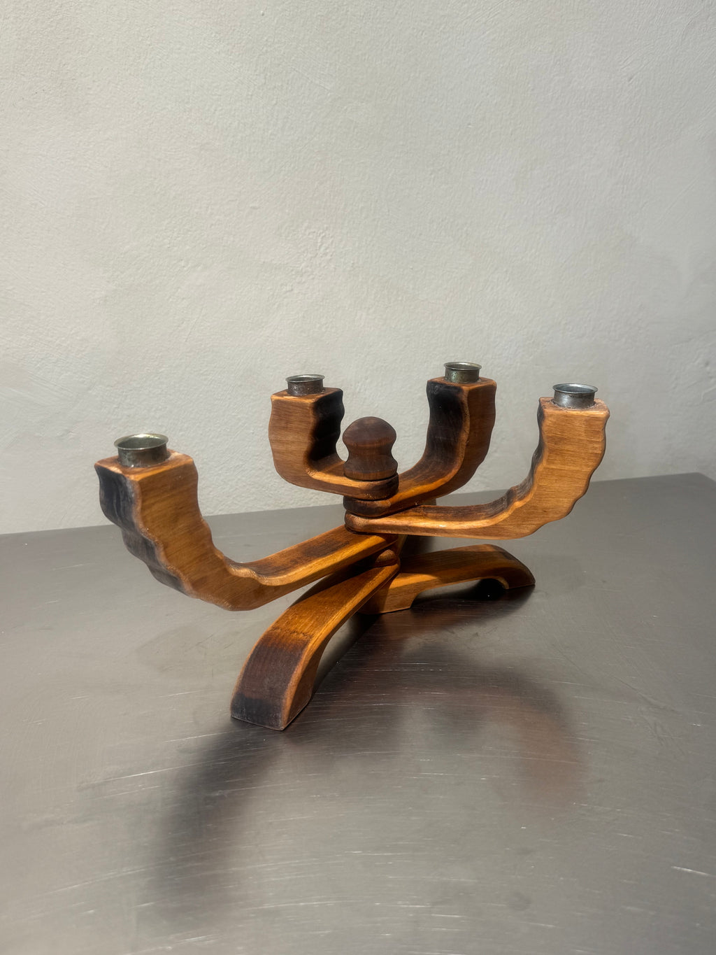 Wooden candelabra with rotating arms and metal cups