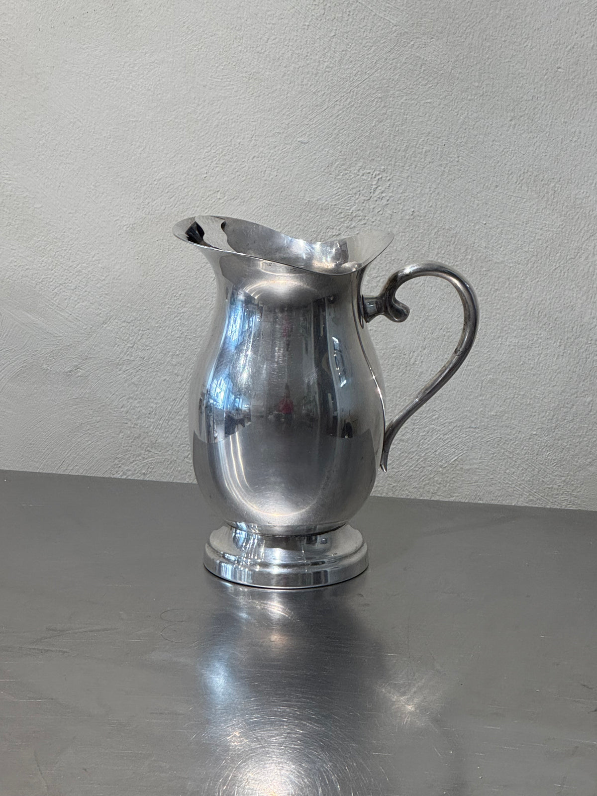Silver-plated water pitcher close-up