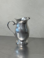 Vintage silver-plated water pitcher detail