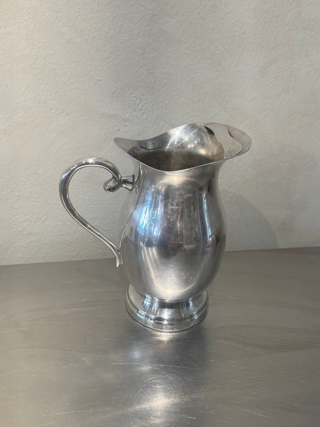 Vintage water pitcher with strainer in spout