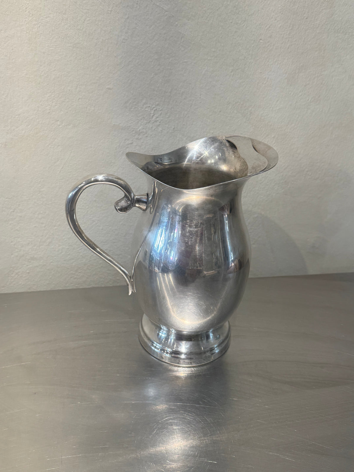 Vintage water pitcher with strainer in spout