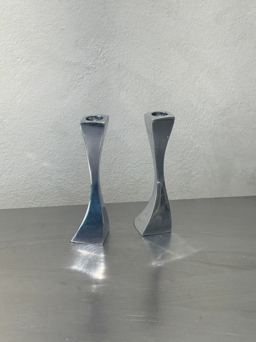 Pair of twisted metal candlesticks
