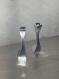 Wavy polished metal candlesticks set of two