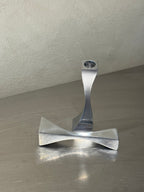 Sculptural wavy metal candlesticks side view
