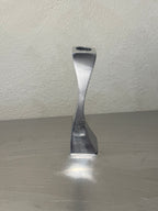 Polished metal candlesticks with twisted stems
