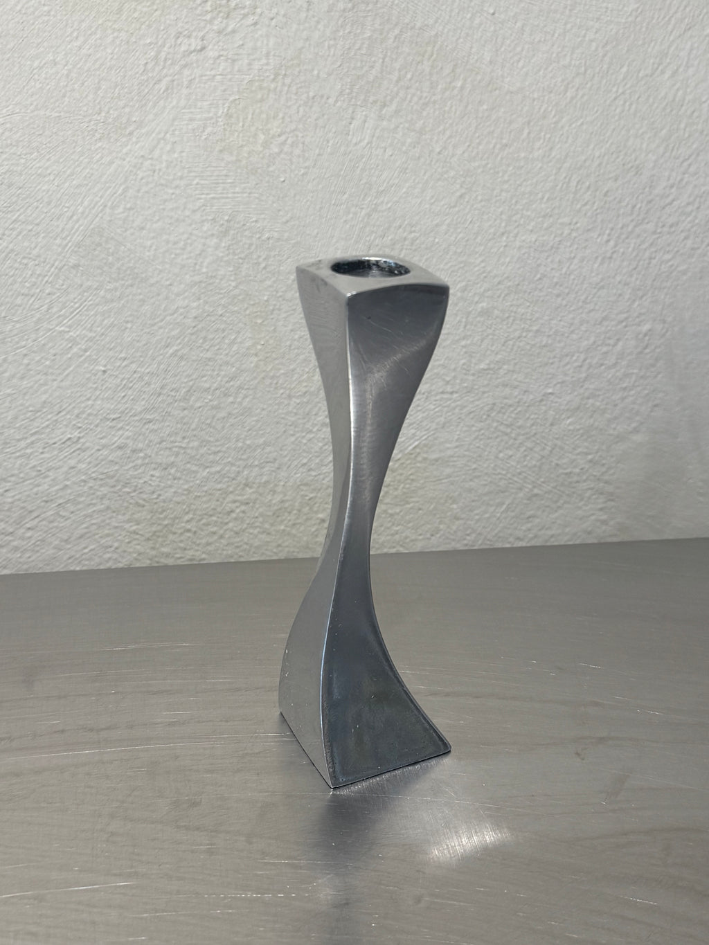 Wavy metal candlestick detail