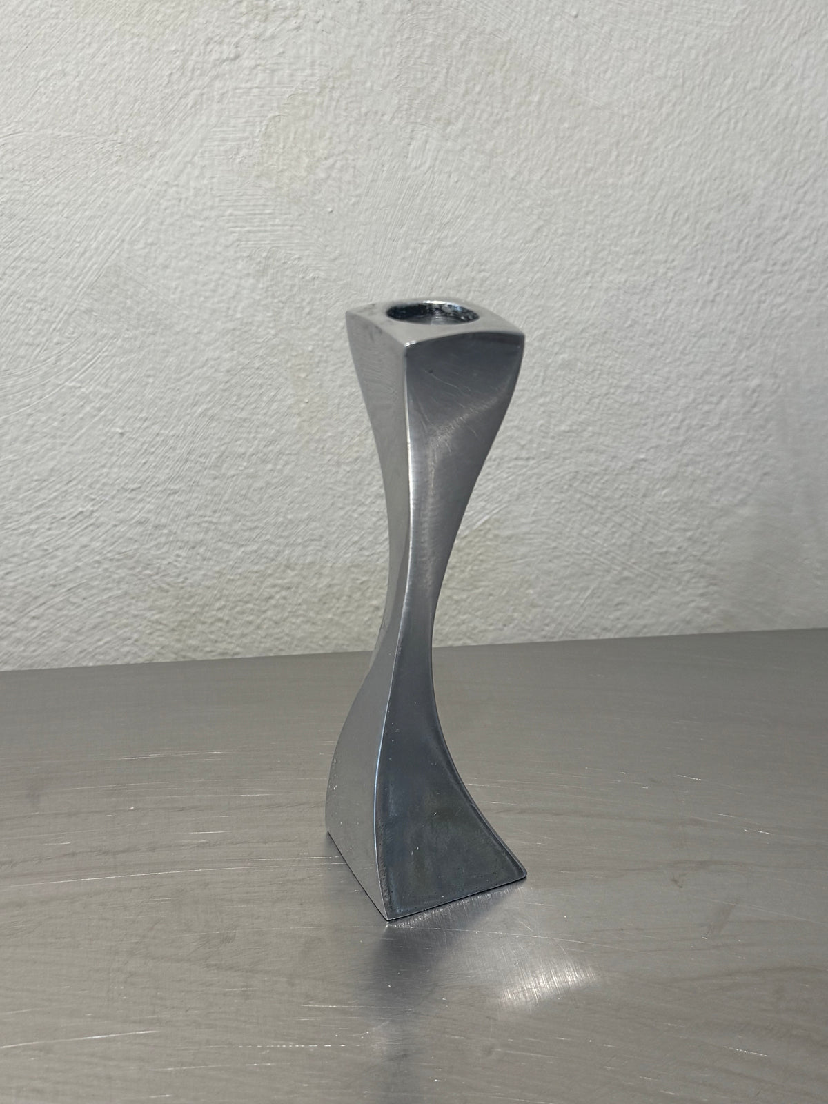 Wavy metal candlestick detail