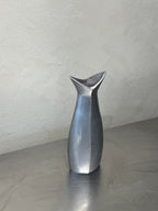 1980s polished metal vase detail