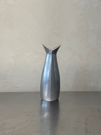 Tall polished metal vase from the 1980s