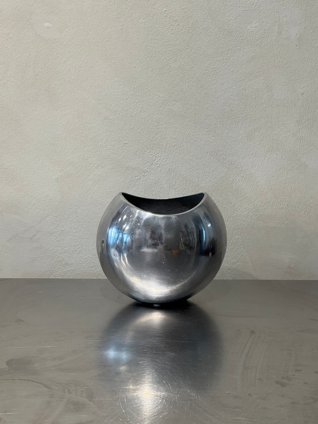 1980s polished metal vase side view