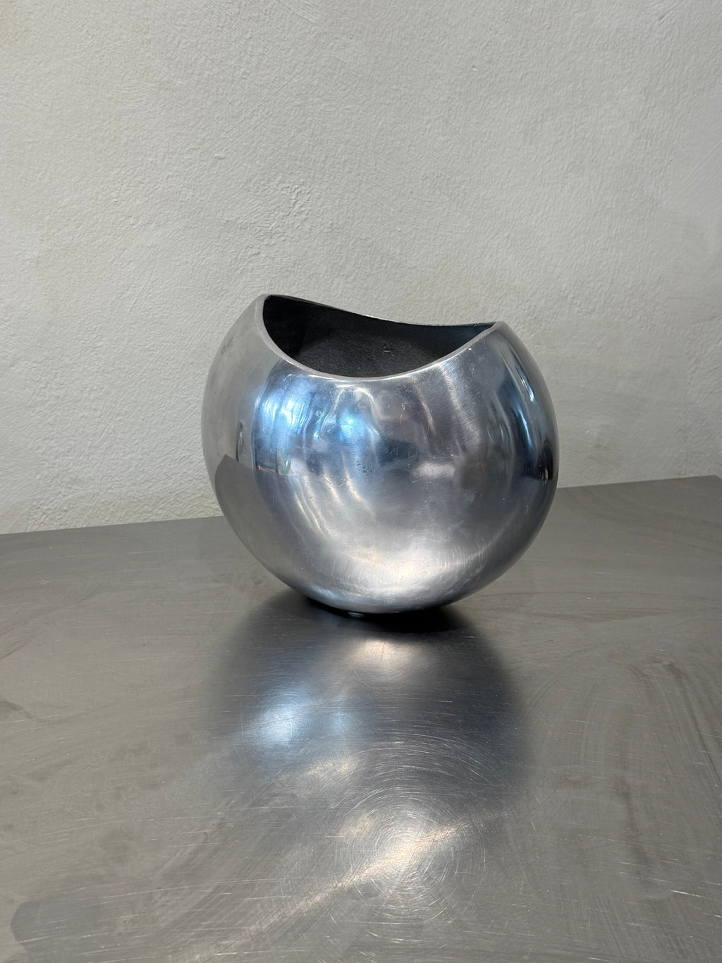 Vintage polished metal vase detail