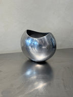 Vintage polished metal vase detail