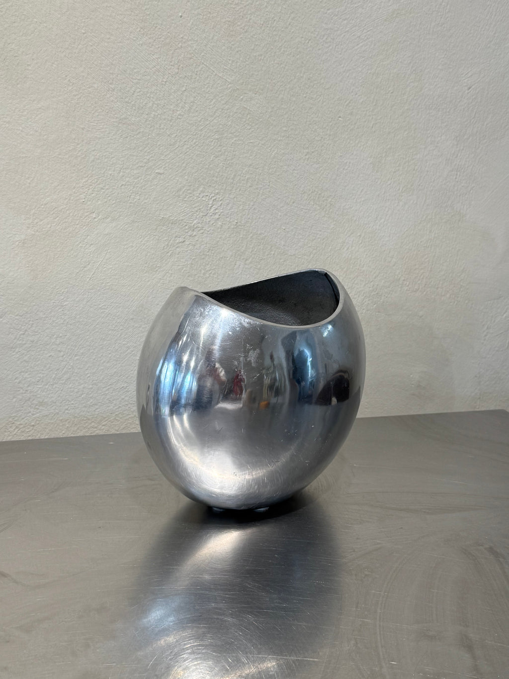 Broad polished metal vase, vintage 1980s