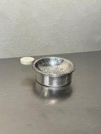1930s silver-plated tea strainer with drip bowl