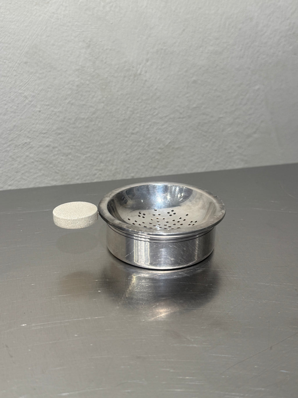 Vintage silver-plated tea strainer and matching bowl