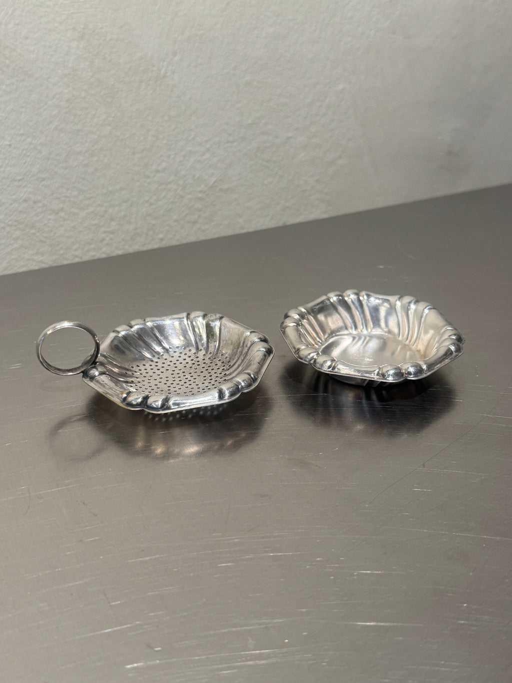 Vintage shell tea strainer and matching bowl detail
