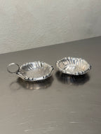 Vintage shell tea strainer and matching bowl detail
