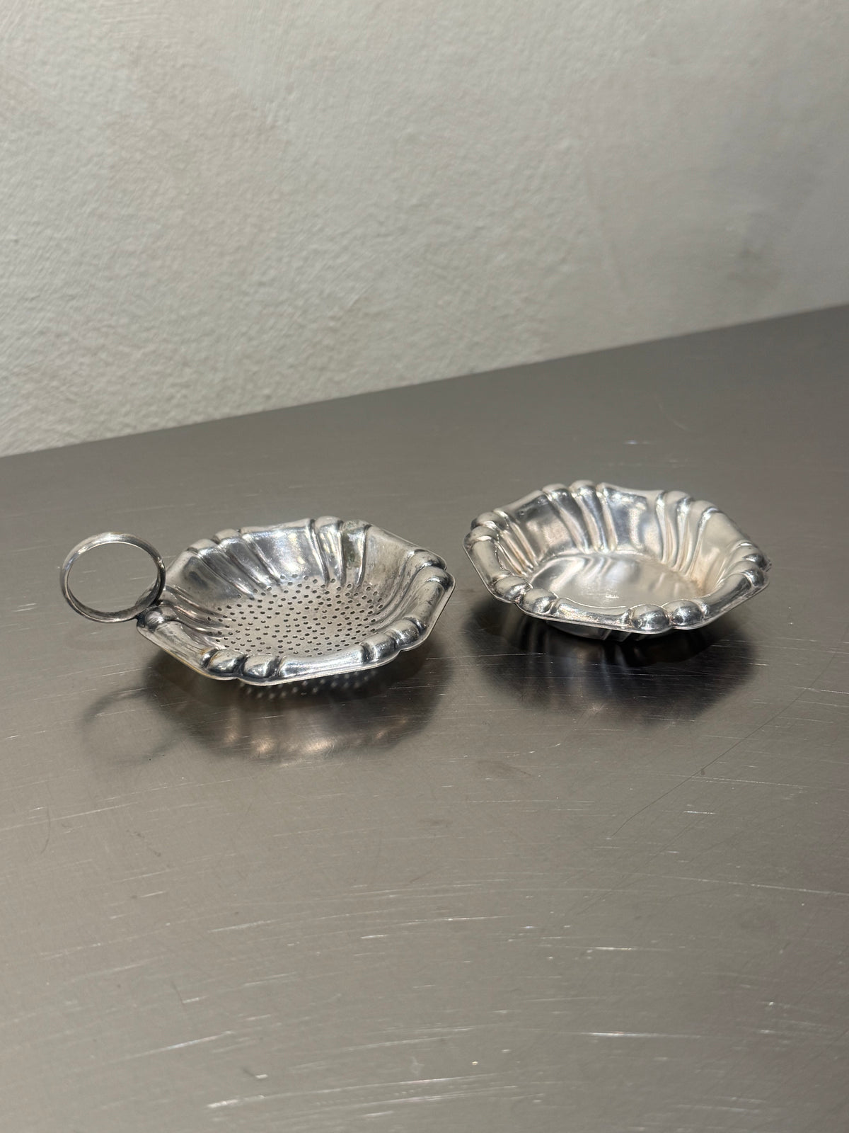 Vintage shell tea strainer and matching bowl detail