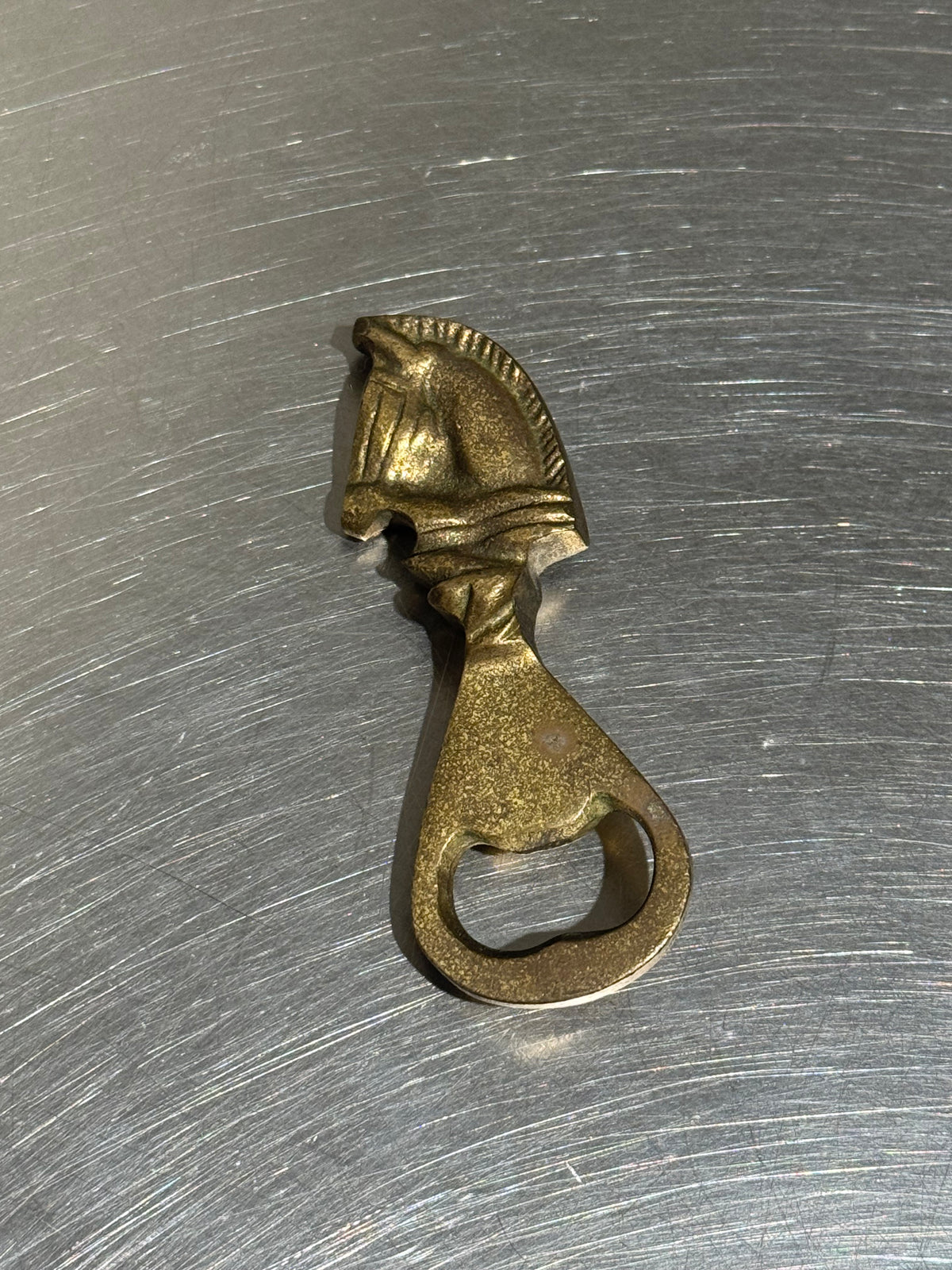 Vintage horse-shaped brass bottle opener