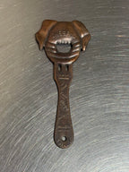 Vintage pig-shaped copper bottle opener