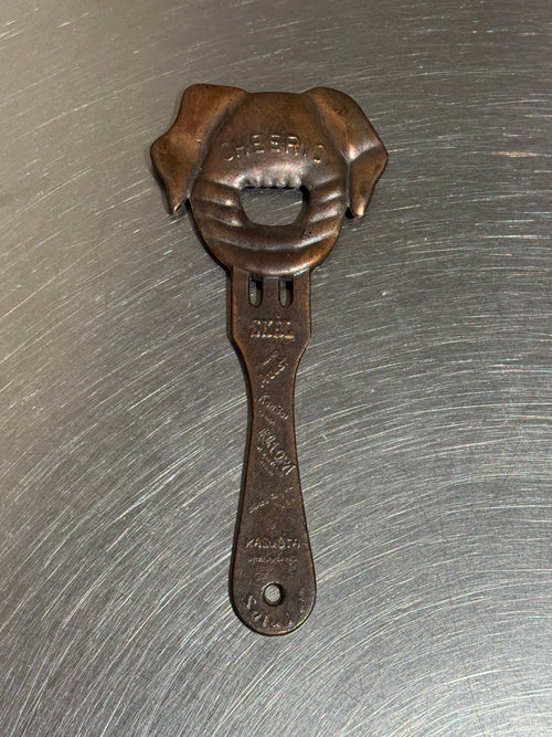 Vintage pig-shaped copper bottle opener