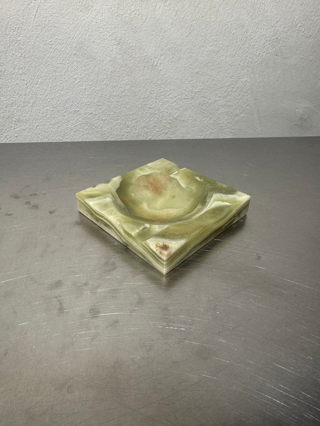 Green onyx ashtray with cream and brown variation