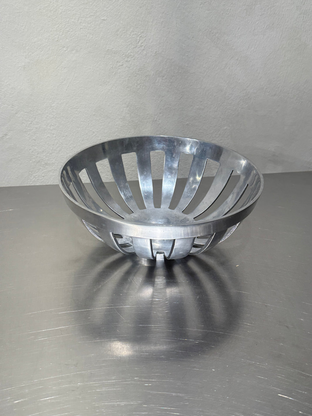 Vintage chrome-plated fruit bowl side view