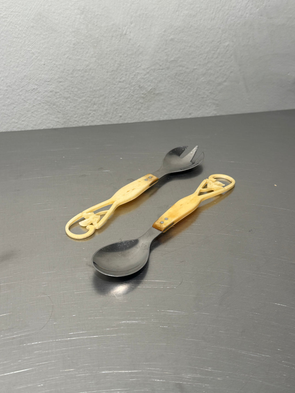Carved bone handle salad servers set of two
