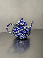 Antique enamel teapot with blue and white marbling