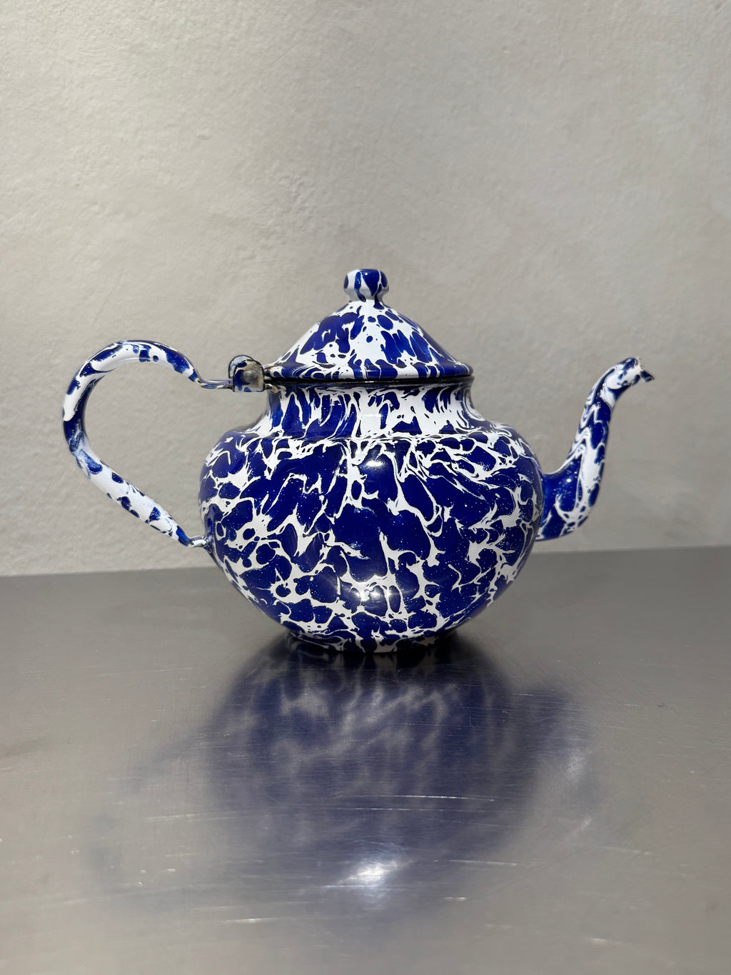 Vintage marbled enamel teapot side view