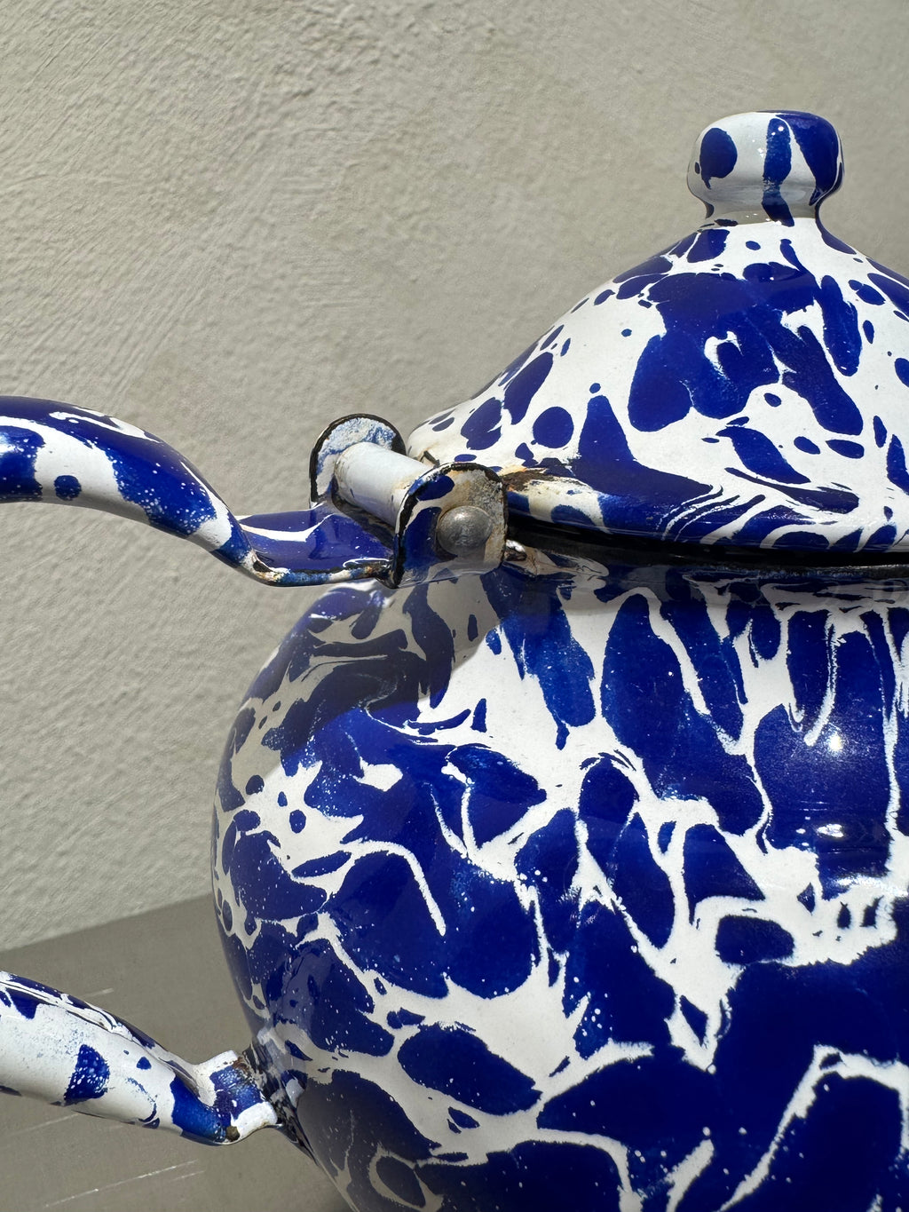 Antique marbled enamel teapot detail