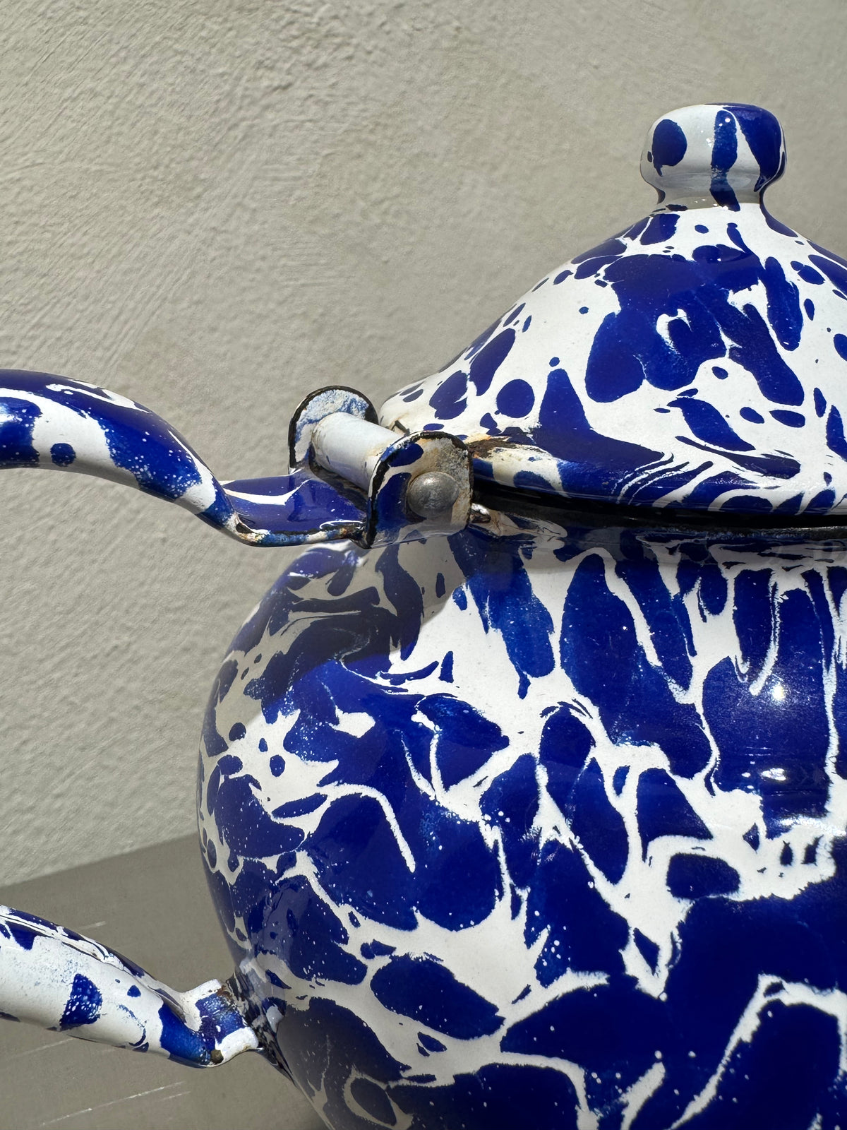 Antique marbled enamel teapot detail