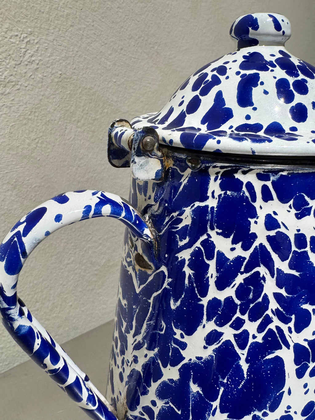 Vintage enamel coffee pot with blue and white marbling