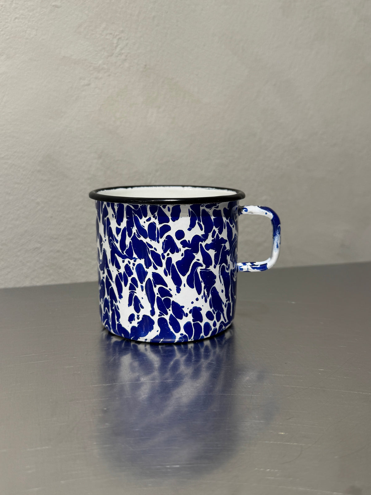 Blue and white marbled enamel mug, mid-century