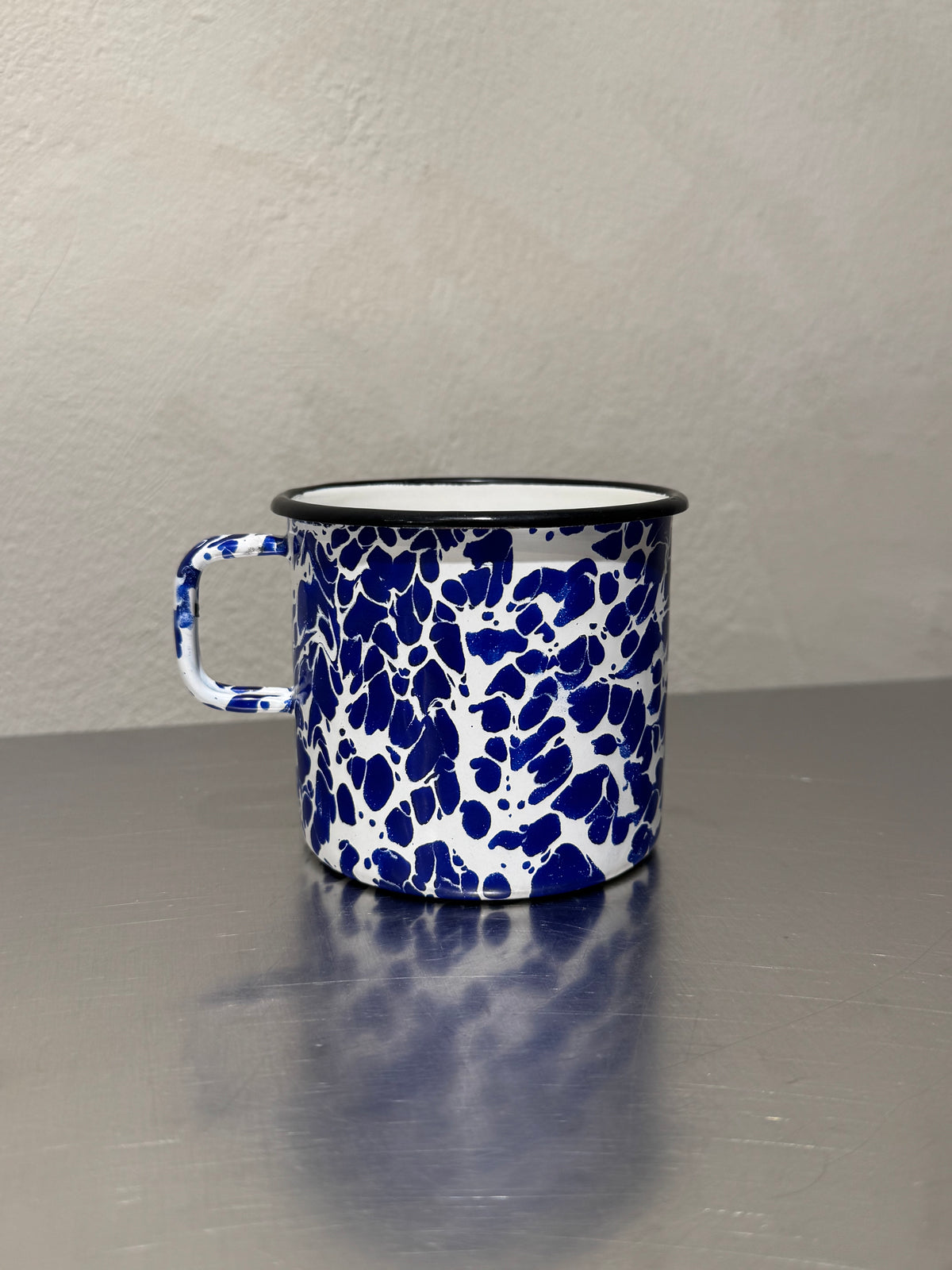 Vintage marbled enamel mug side view