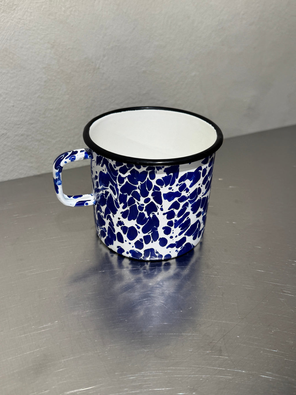 Mid-century enamel mug with blue and white marbling