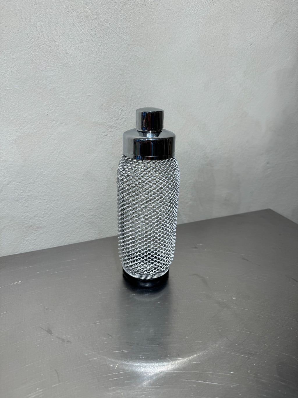 Vintage cocktail shaker with metal mesh from the 1960s
