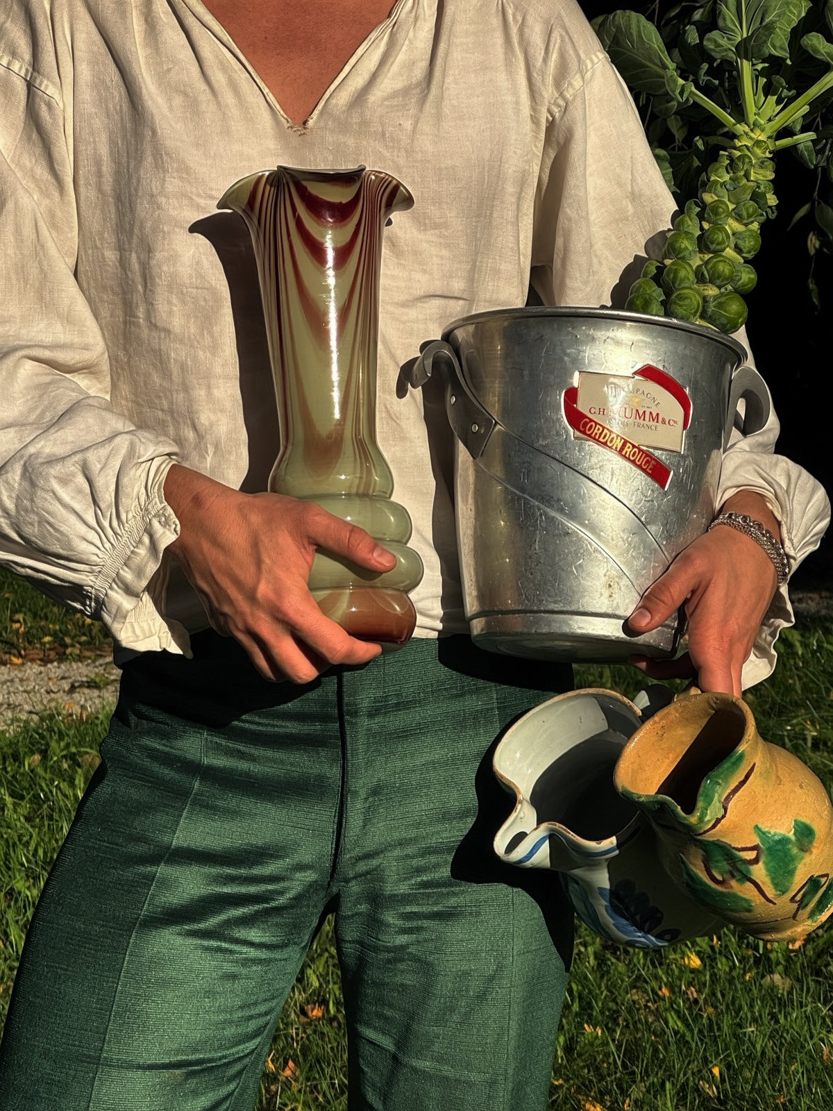 Vintage vases and a French champagne bucket outdoors