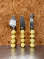 HKLiving Lemon cheese knife set leaning against birch burl veneer