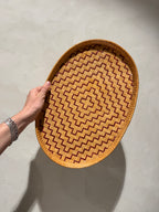 Mid-century rattan tray held upright